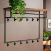 Hängende Garderobe mit Ablage aus Nussbaum - Pilamonia